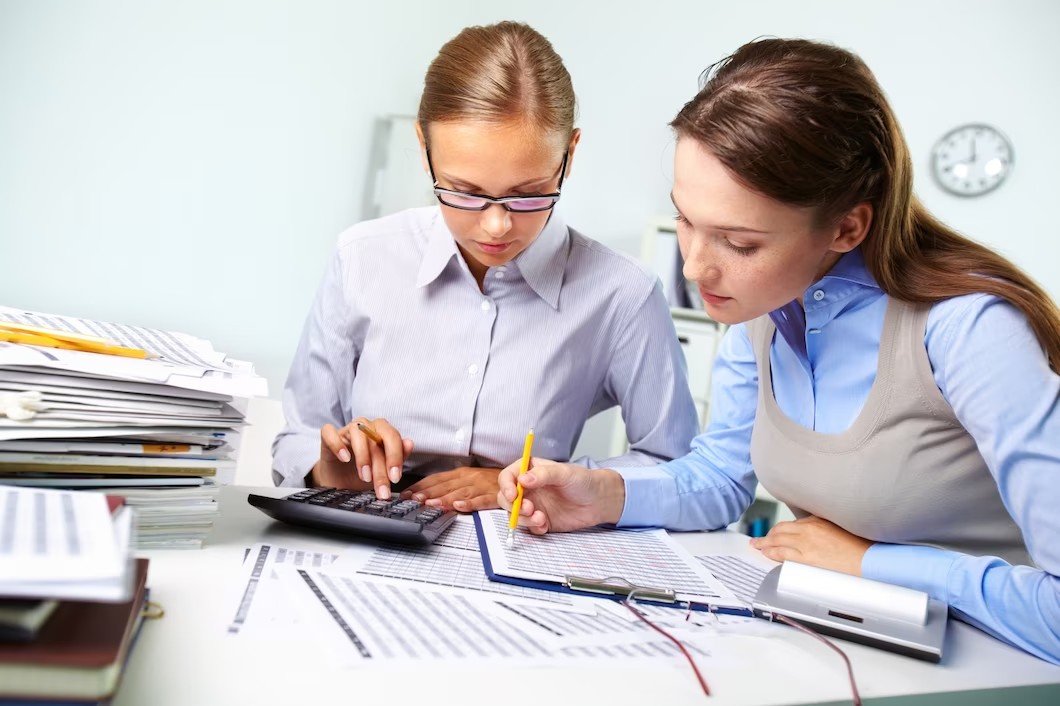 businesswomen-reviewing-results_1098-1682